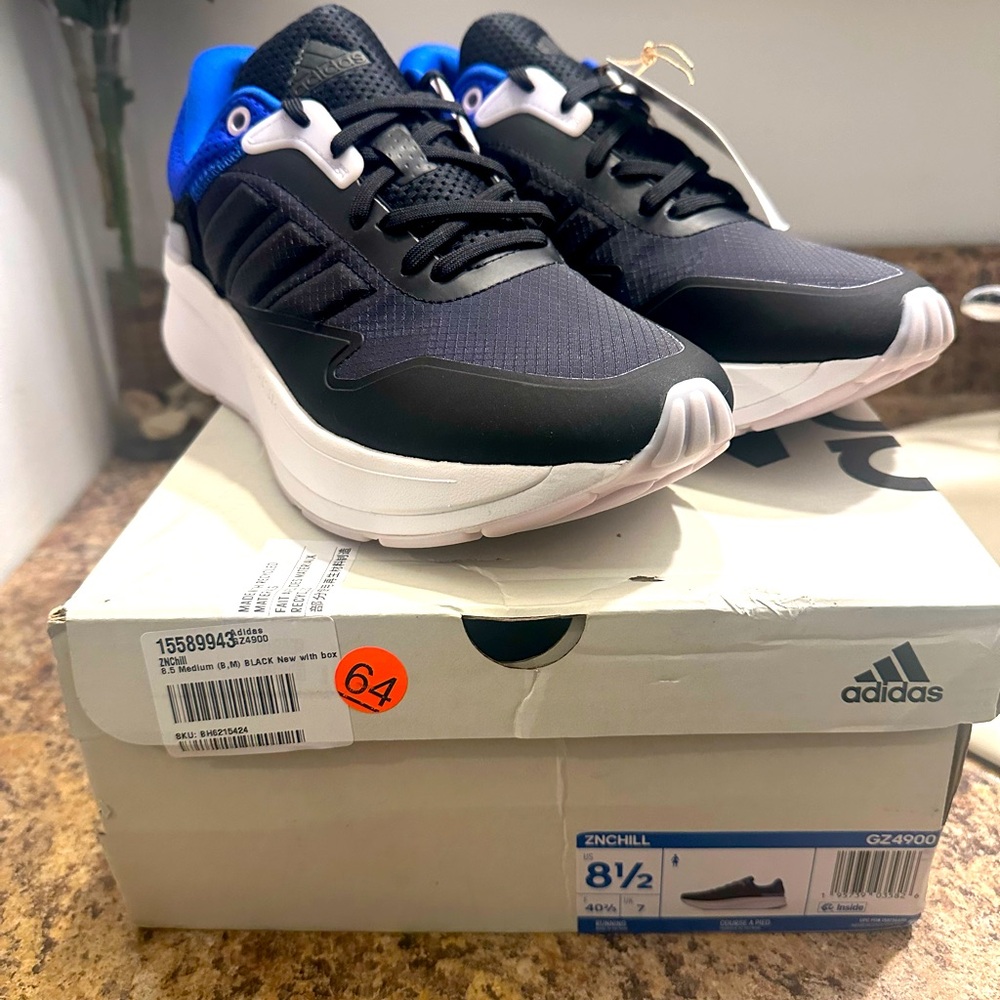 Adidas Black and Blue Sneakers with Modern Design.